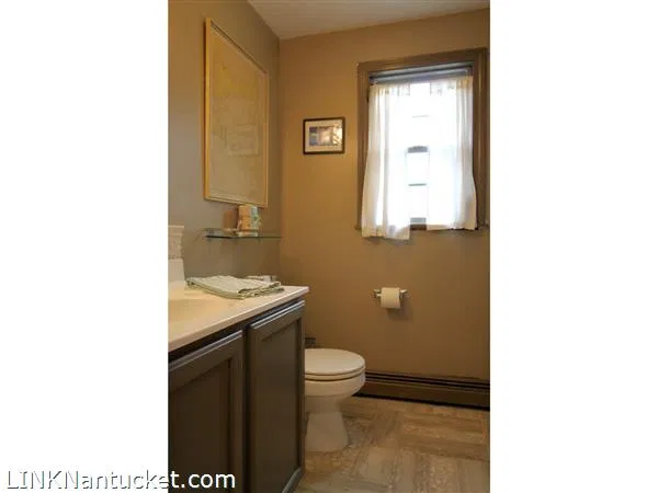 Second bathroom with vanity and window
