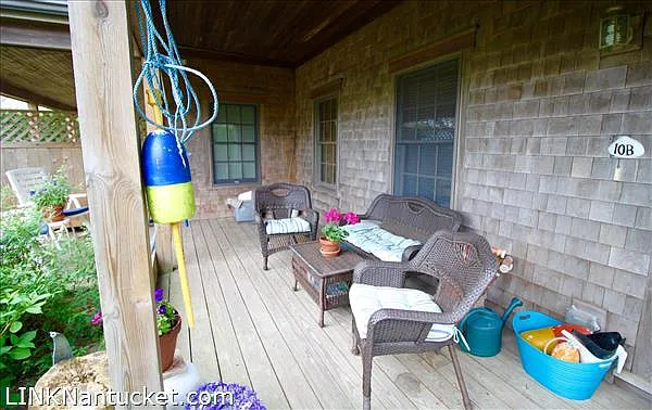 Covered entry porch with seating